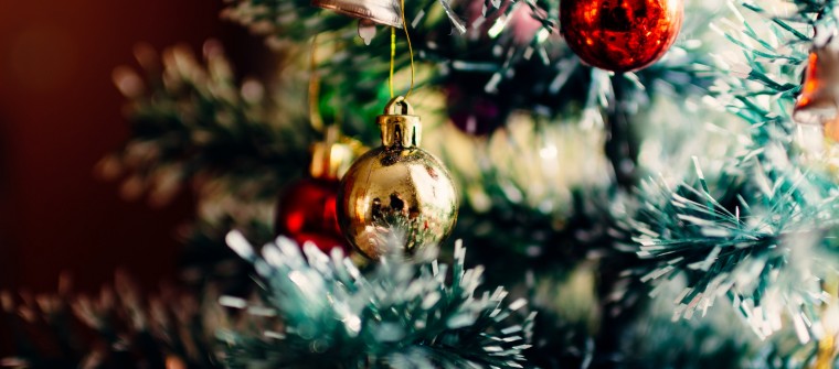 Christmas tree branches decorated in white gold and red